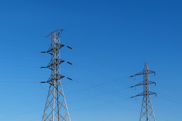 Fototapeta premium high voltage power lines on sky. pole