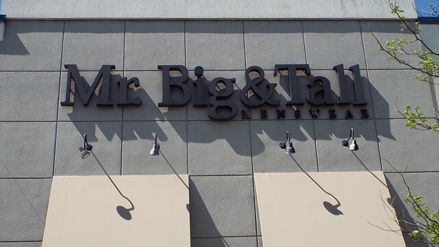 Nepean, ON, Canada-June 19,2025: The storefront sign for a clothing store named "Mr. Big and Tall Menswear" at 1719 Merivale Road.
