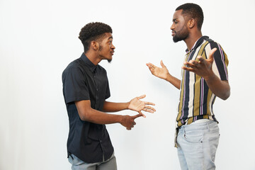 Two African American men engaged in a lively conversation, expressing emotions and gesturing. Their...