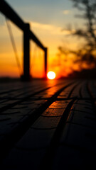 Sunset Reflection on Dark Wooden Surface with Tire Marks vertical