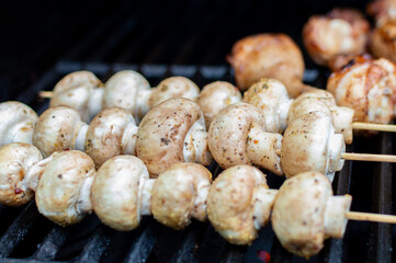 Seasoned Juicy Mushrooms Grilling Outdoors on a Summer Weekend