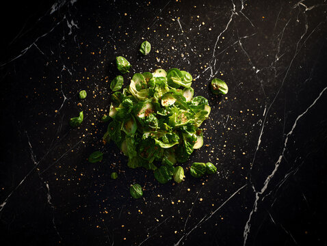 Overhead shot of a Traditional Greek Salad spread on a dark marble countertop
