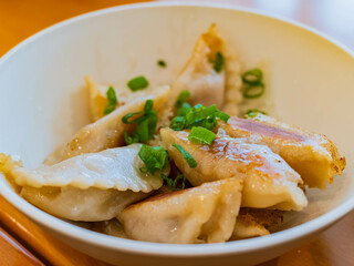 Close up shot of a delicious Chinese style dumpling bowl