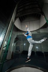 A woman flies in a wind tunnel. Free fall simulator.