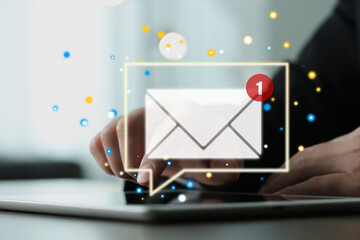 Email marketing, new message notification. Man using tablet computer at table, closeup