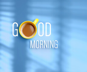 Cup of coffee instead of letter O in inscription Good Morning on light blue background, top view