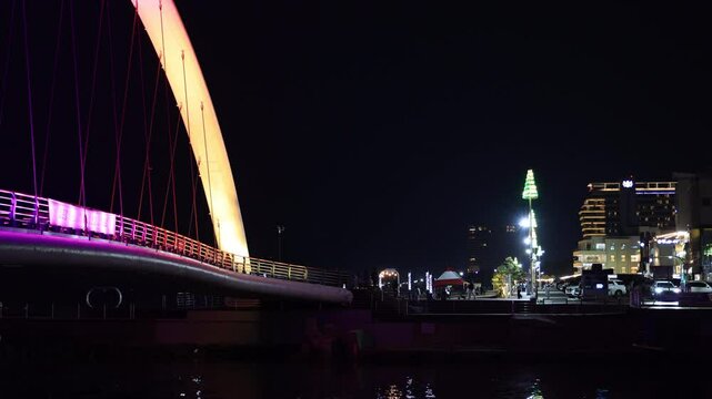 Gangmun Sotdae Bridge and Beachfront Lights at Night