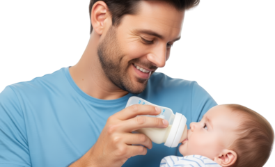 Father feeding baby from bottle close up smiling isolate infant milk newborn