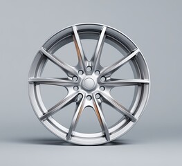 Sleek silver alloy wheel with ten spokes, subtle orange accents, and a central hubcap against a neutral grey background