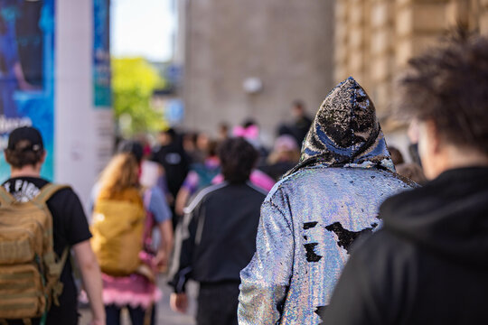 Crowd at Protest Left Wing Demonstrators gathering on street wearing shiny coat