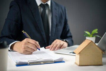 Agent signing real estate deed, showcasing secure property contract deals, legal documentation....