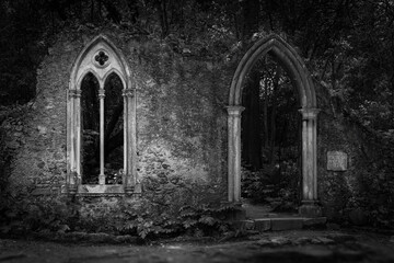 Black and white photography of gothic ruins abandoned church stone arch medieval window forest...