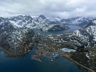 Dramatic Drone View of Snowy Mountains and Fjords in Lofoten, Norway – Isolated Fishing Outpost,...