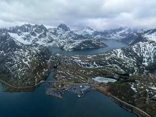 Dramatic Drone View of Snowy Mountains and Fjords in Lofoten, Norway – Isolated Fishing Outpost,...