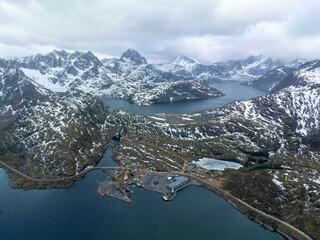 Dramatic Drone View of Snowy Mountains and Fjords in Lofoten, Norway – Isolated Fishing Outpost,...