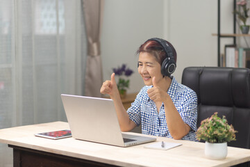 Seniors  woman is learning to upskill  AI technology.