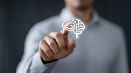 Professional businessman touching glowing brain icon representing artificial intelligence technology