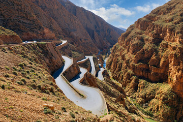 Winding road through a red canyon.