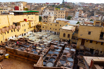 Fez leather tannery,  workers and vats.