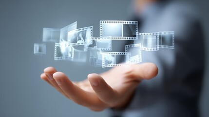 Obraz premium A hand holding digital images in a futuristic setting, representing innovation.