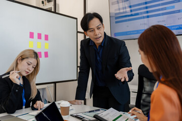 group of businessman are brainstorming about their business project, these entrepreneurs are...