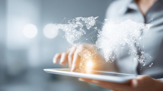 A person uses a tablet with a digital world map interface for innovative concepts.