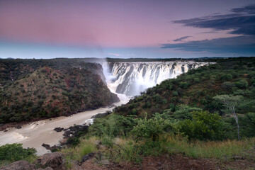 Ruacana Falls under a pastel Sky.