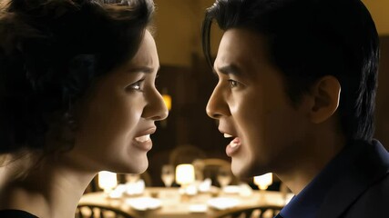 Intense conversation between two characters in a restaurant setting