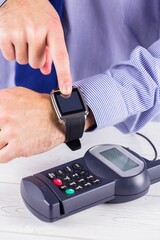 Man using smart watch to express pay