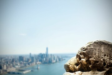 Large rock overlooking coastline city