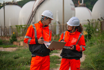 Petroleum Engineer working at the oil refinery industry plant, discuss and meeting brainstorm session