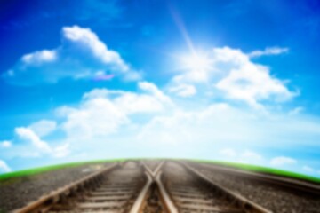 Railway tracks against cloudy sky