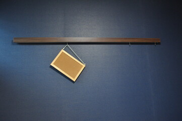 Empty Bulletin Board Hanging on Blue Wall