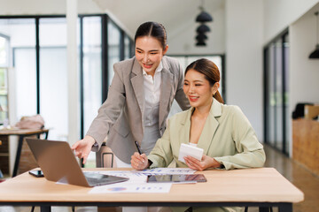 Team of business partnership use calculator to calculate coworkers analysis strategy with...