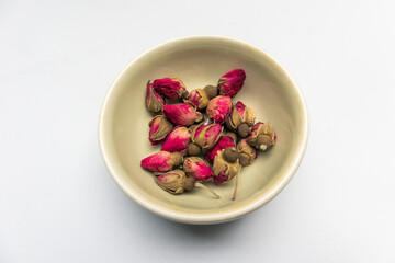 Rose bud tea isolated. Dried Rose Flower Herbal Tea. Top view