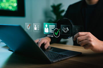 Job fair recruitment concept with business professional reviewing candidate profile through digital interface on laptop, hiring process innovation, online resume screening, and employment search