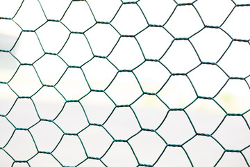 green colored lattice, fence at sports stadium