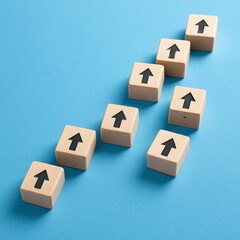 Wooden blocks with upward arrows ascend on a blue surface