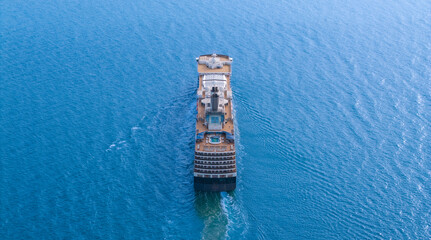 Aerial view of beautiful white cruise ship above luxury cruise in the ocean sea at early in the morning time concept smart tourism travel on holiday take a vacation time on summer