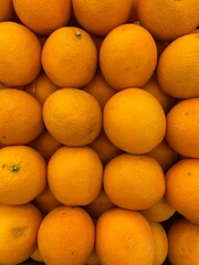 Fresh oranges stacked beautifully, rich in vitamin C and bursting with sweet citrus flavor. A perfect pick for health and refreshment.