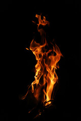 Fototapeta premium Fire flames on black background. Closeup of fire flames isolated on black background