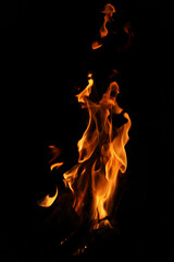 Fire flames on black background. Closeup of fire flames isolated on black background