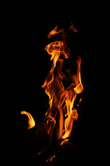 Fire flames on black background. Closeup of fire flames isolated on black background