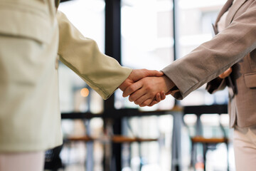 Happy business woman asian manager handshaking client at meeting. Smiling female hr hiring recruit...