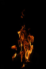 Fire flames on black background. Closeup of fire flames isolated on black background