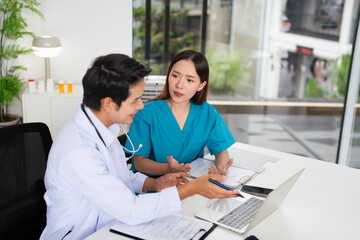 Fototapeta premium doctor and nurse is discussing and brainstorming on patient medical record after diagnosis for precise care plan with experience senior physician specialist.