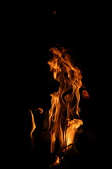 Fire flames on black background. Closeup of fire flames isolated on black background