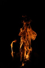Fire flames on black background. Closeup of fire flames isolated on black background