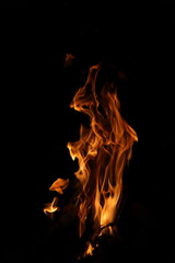 Fire flames on black background. Closeup of fire flames isolated on black background