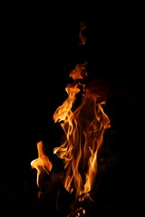 Fire flames on black background. Closeup of fire flames isolated on black background